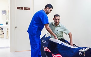 Male patient entering a hyperbaric oxygen therapy chamber for anti-cancer treatment in Mexico